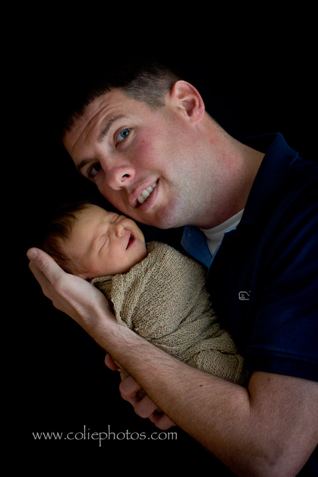 newborn with dad smiling