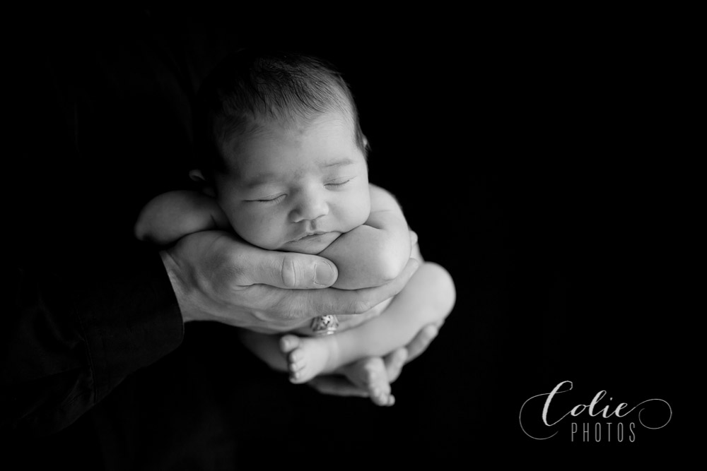 newborn in dad's hands